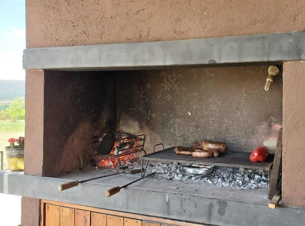 Asado in progress on the parrilla