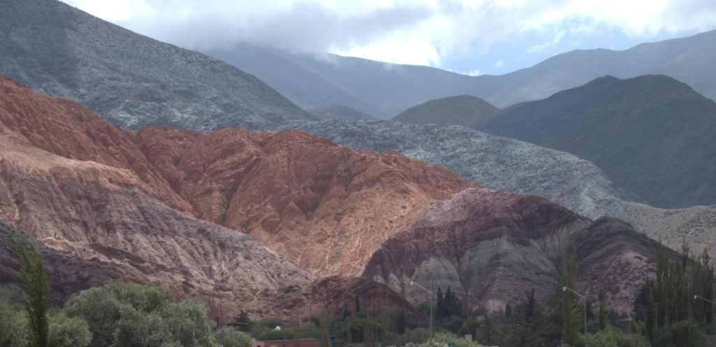 Multi-colored mountain behind Purmamarca, Argentina