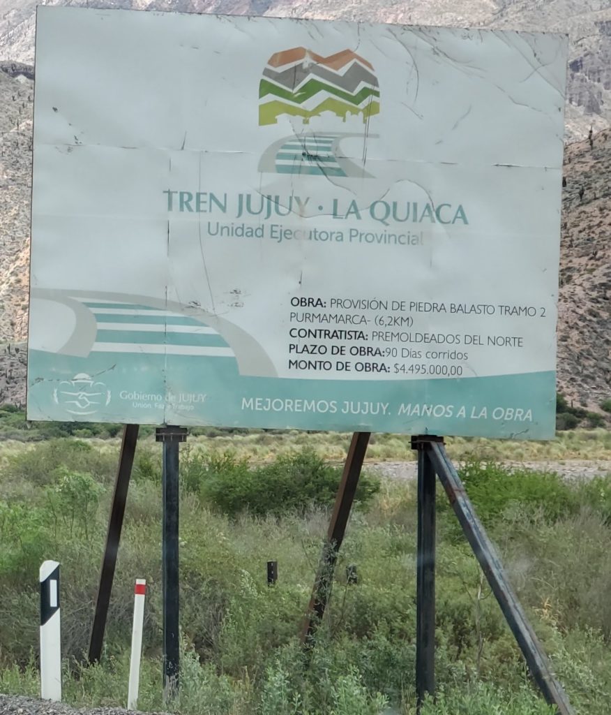 Sign announcing on part of train line restoration.